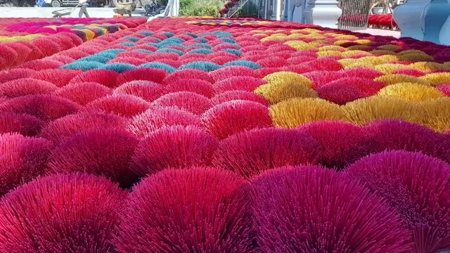 Bunches of colourful bamboo sticks in Quảng Phú Cầu Village.